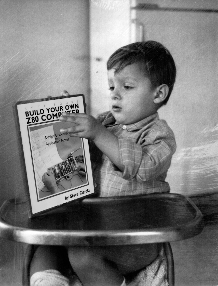 Photo of baby Ingo holding a computer book